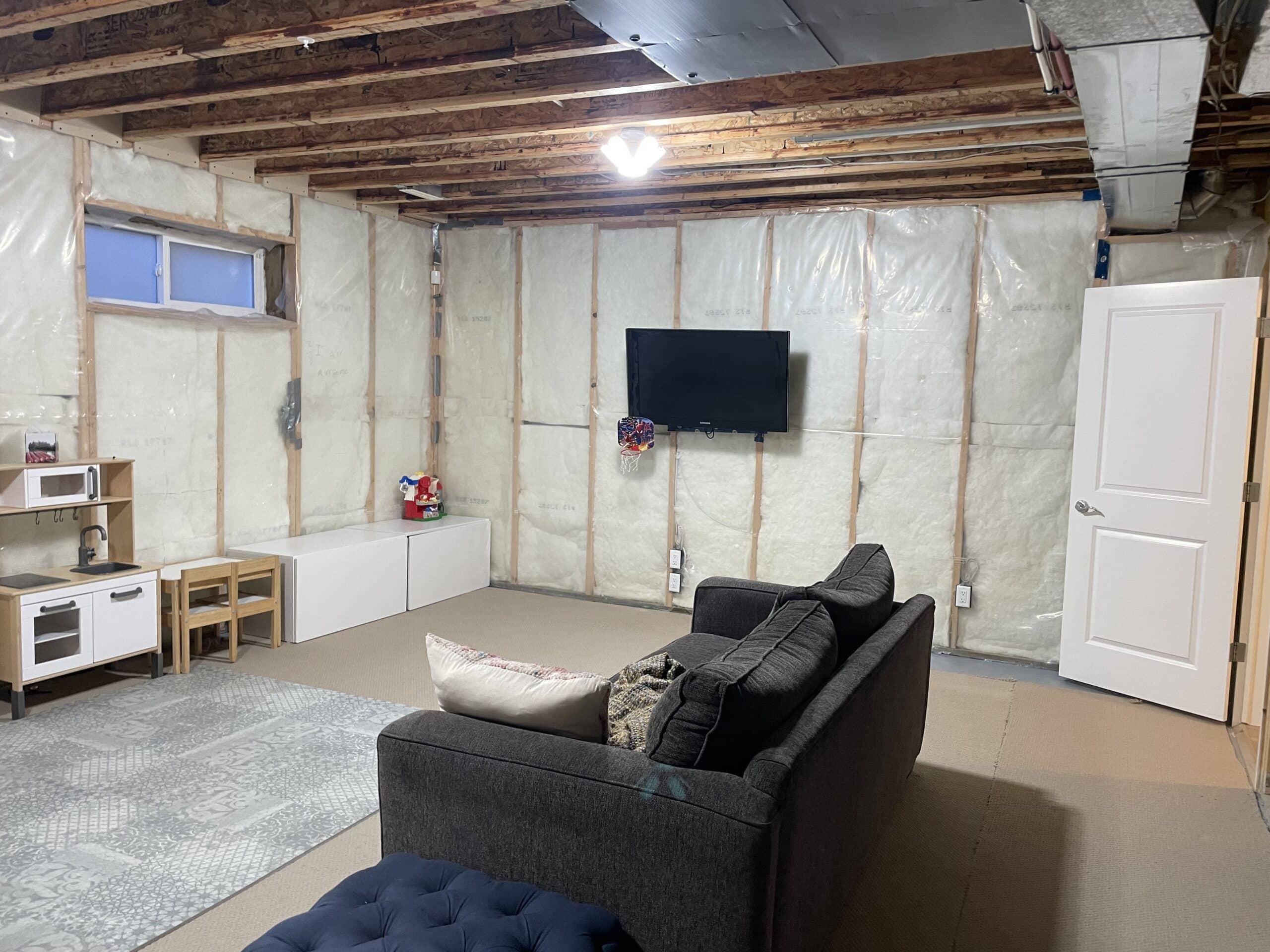 Unfinished Garrison Green Calgary basement before renovation showing future family living area