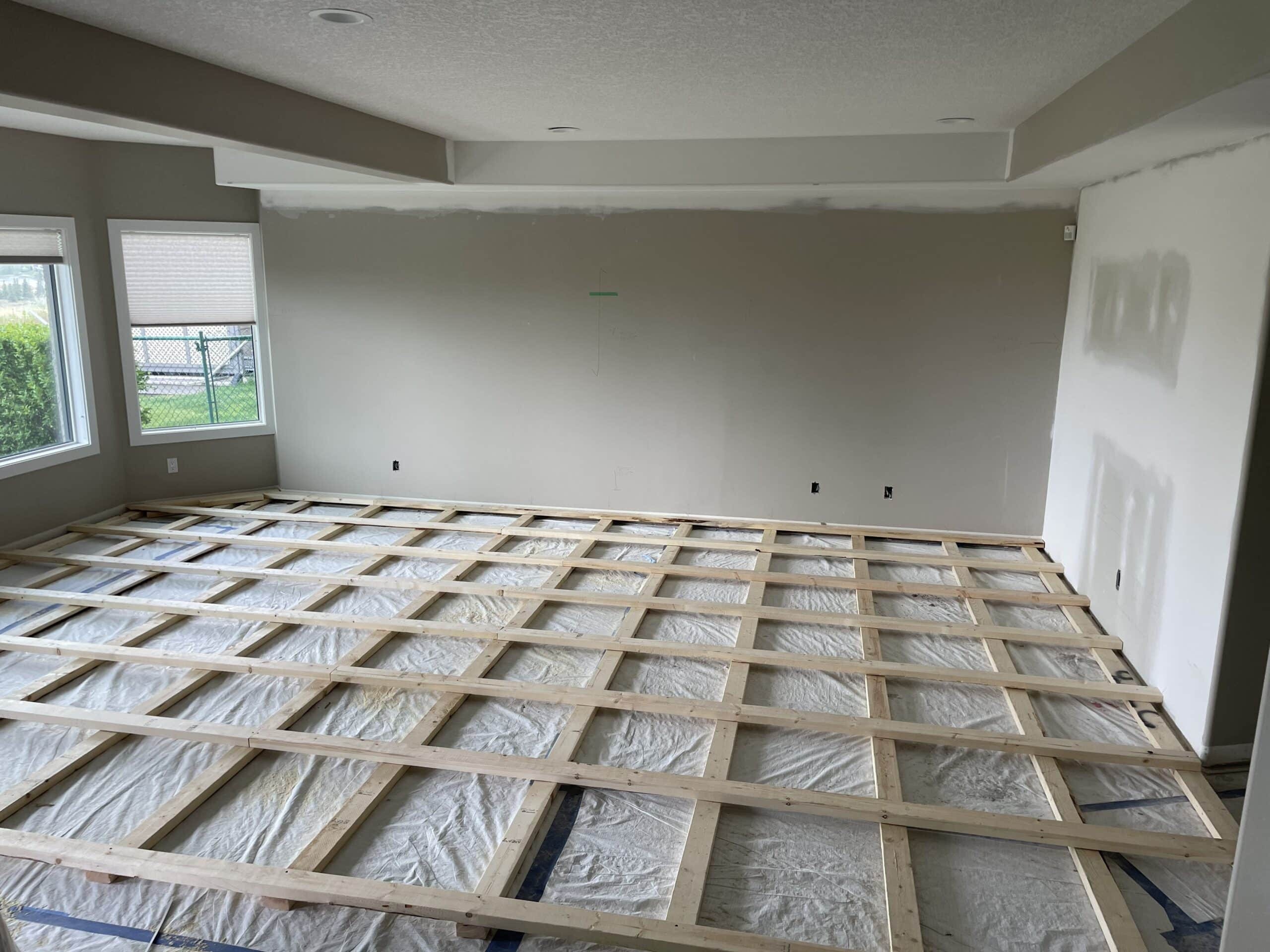 Sprung dance floor framing during Mt Douglas Cir SE basement renovation in Calgary
